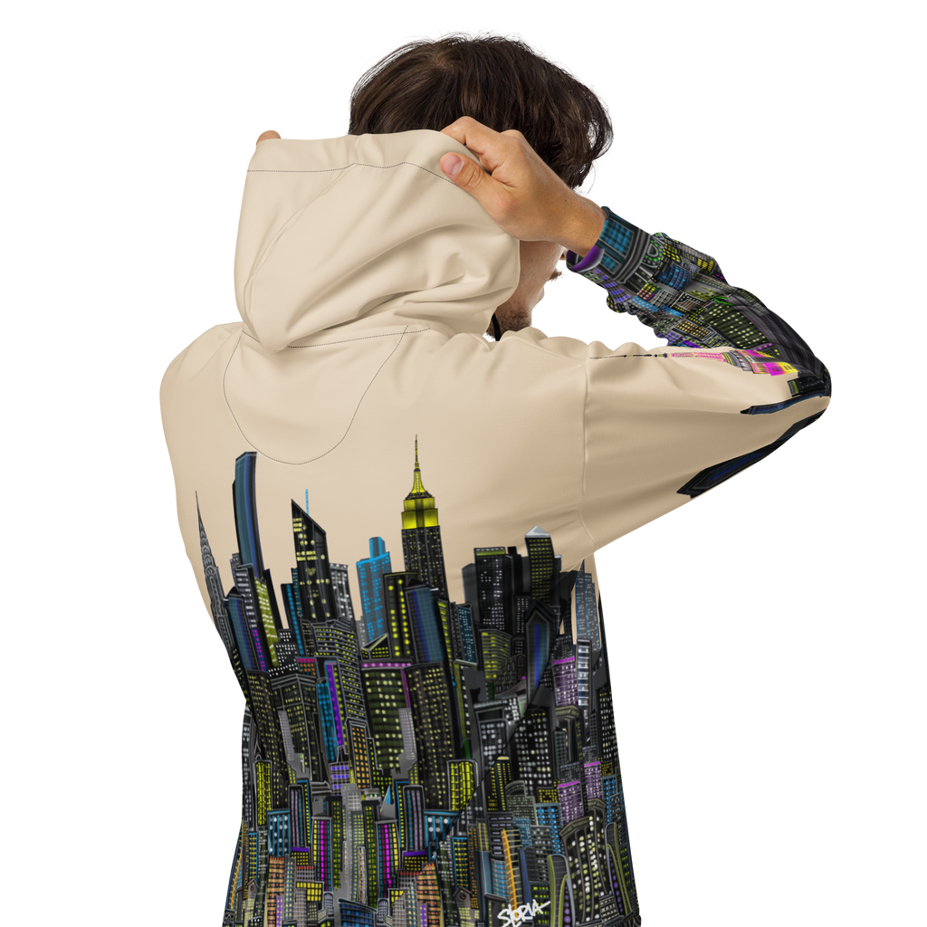 Person wearing a beige hoodie with a cityscape Loria NYC Art design on the back, on a white background
