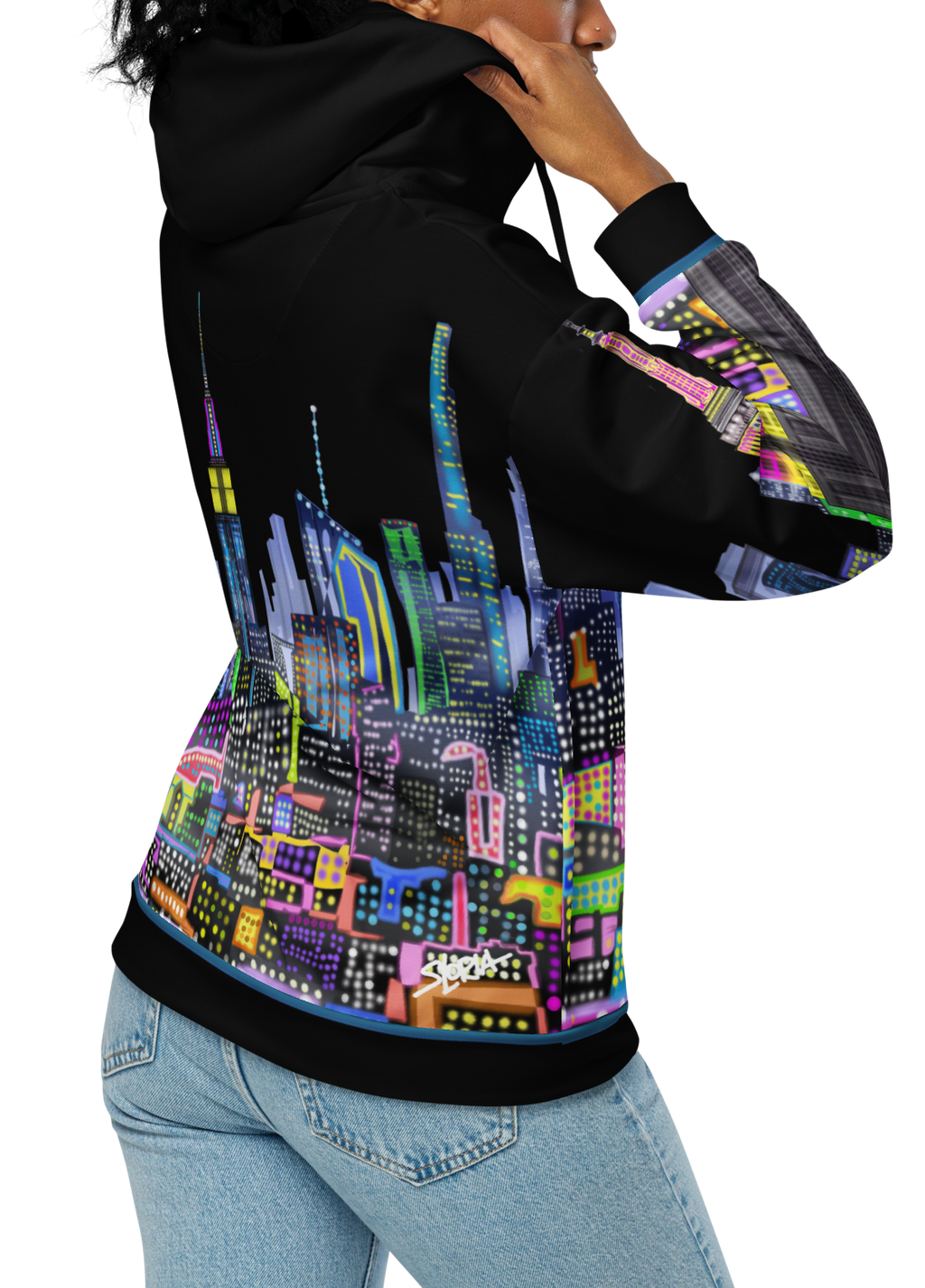 Person wearing a black hoodie with colorful cityscape Loria NYC Art design on the back, on a white background