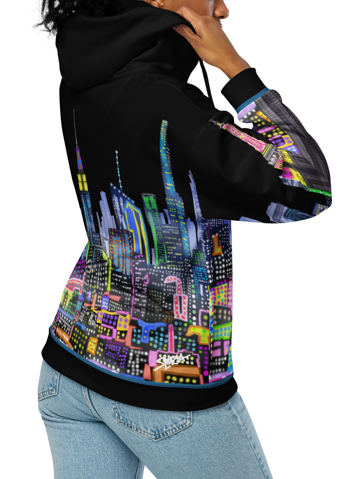 Person wearing a black hoodie with colorful cityscape Loria NYC Art design on the back, on a white background