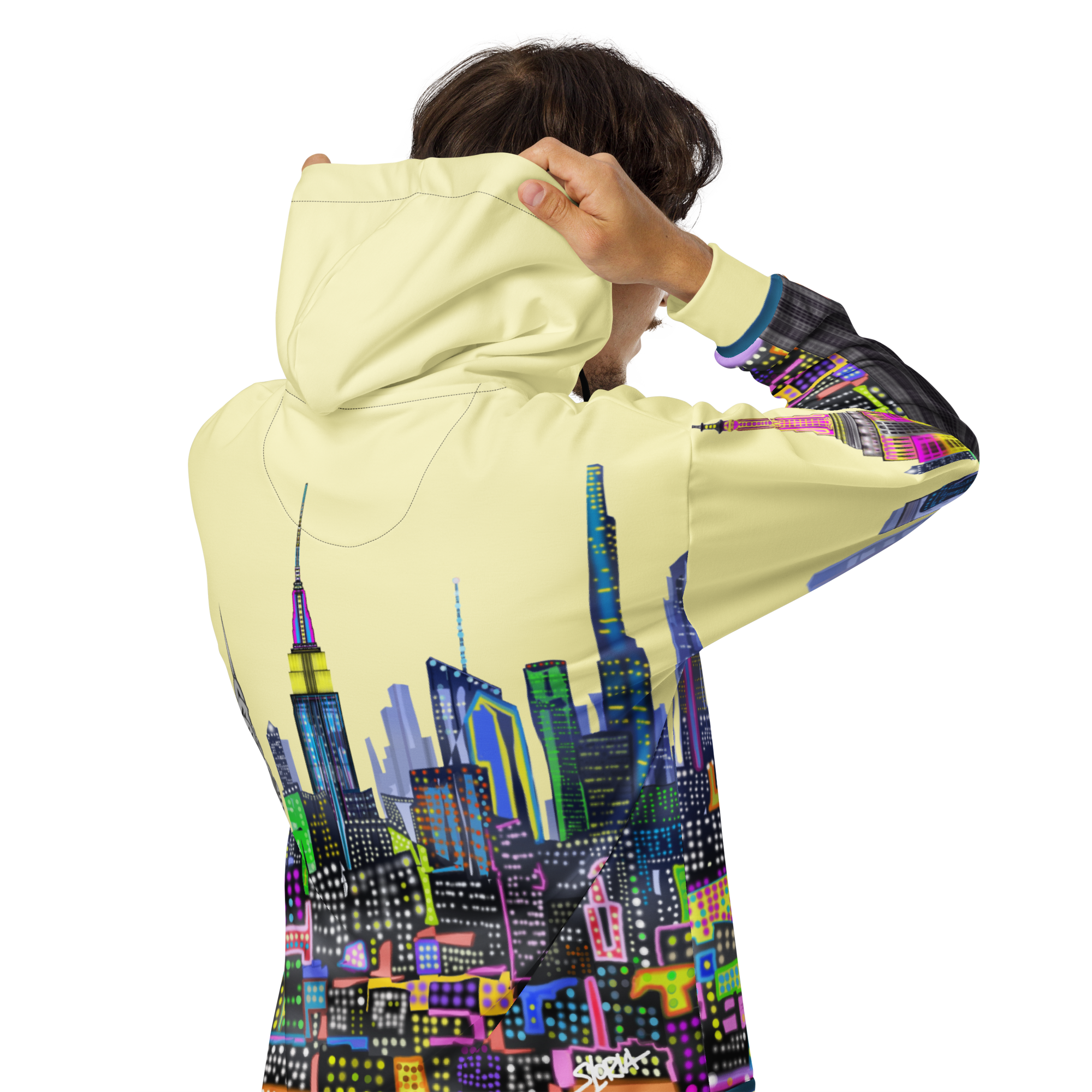 Person wearing a hoodie with a Loria NYC Art colorful cityscape design on the back