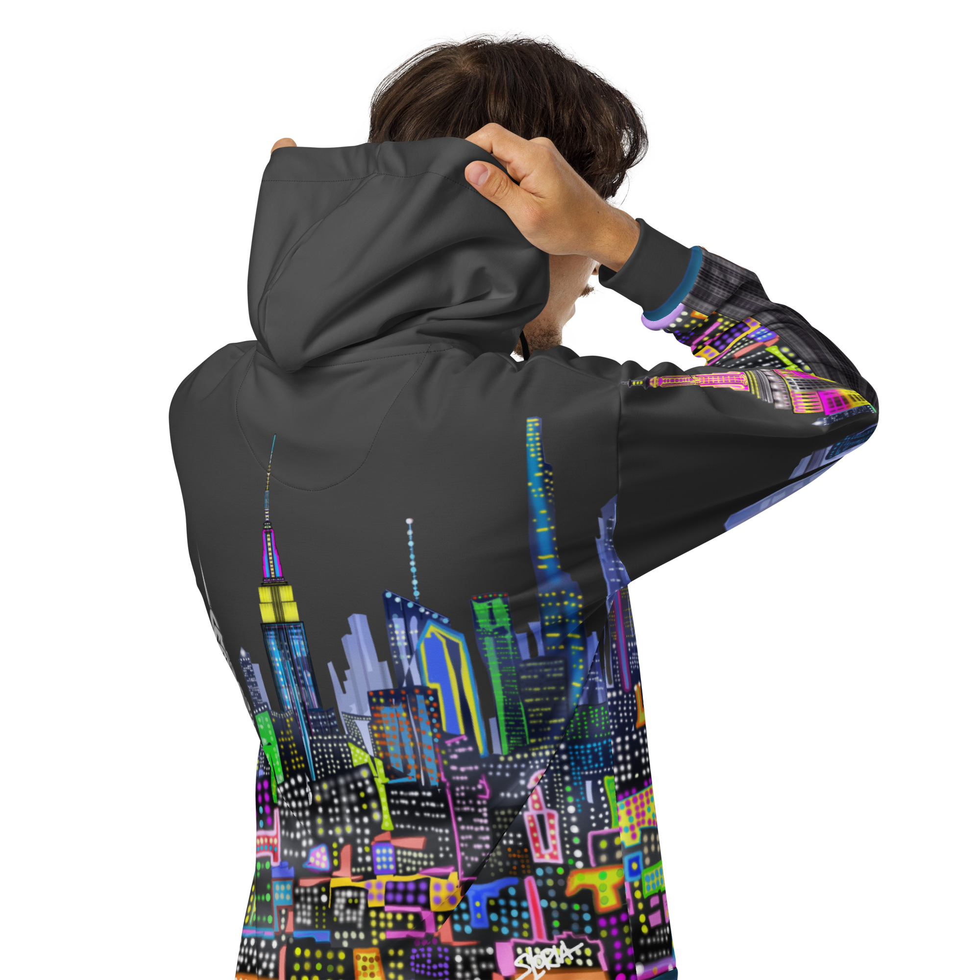 Person wearing a hoodie with a colorful Loria NYC Art cityscape design on the back