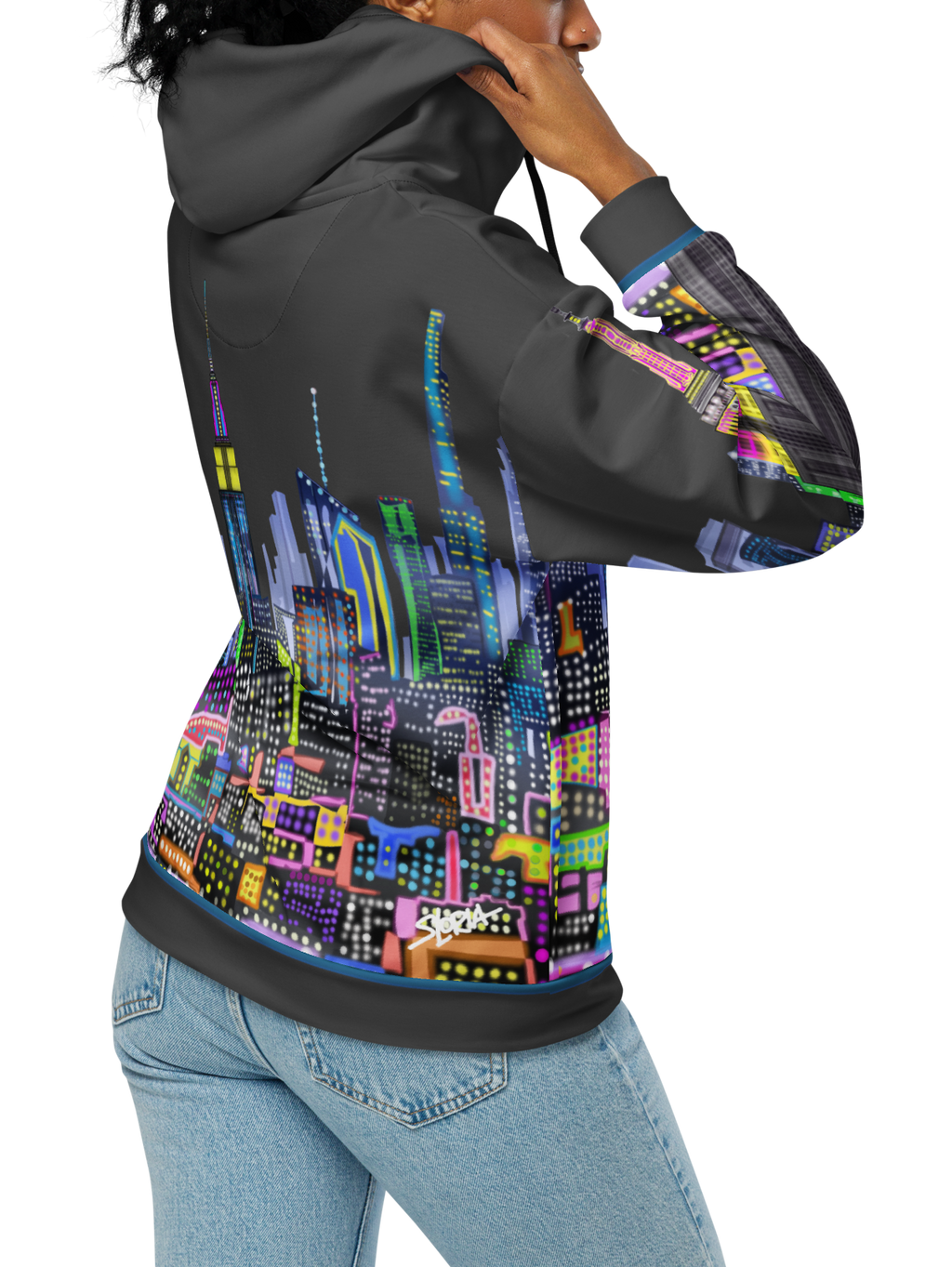 Person wearing a hoodie with a Loria NYC Art colorful cityscape design on a white background