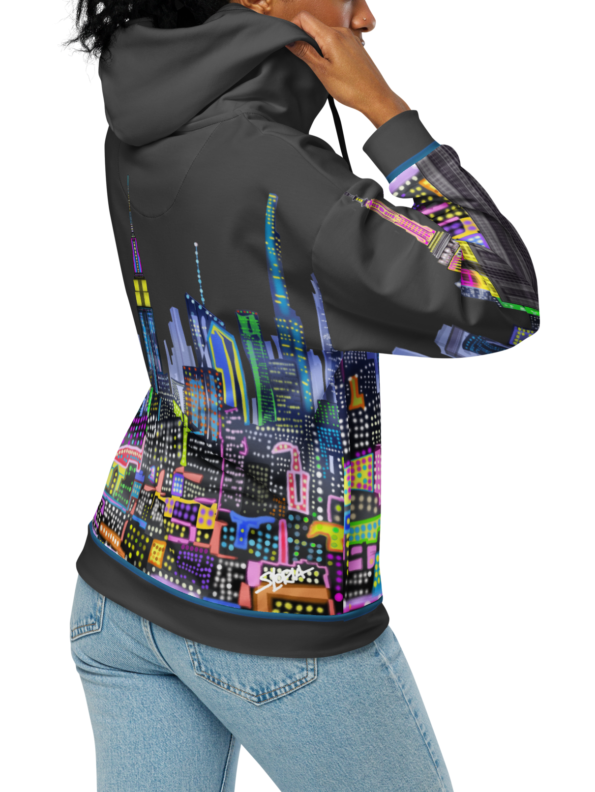 Person wearing a hoodie with a Loria NYC Art colorful cityscape design on a white background