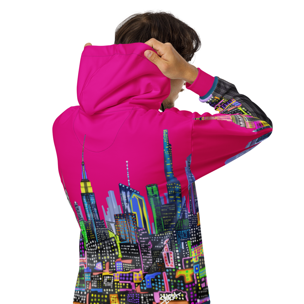 Person wearing a pink hoodie with a colorful Loria NYC Art  cityscape design on the back, on a white background.