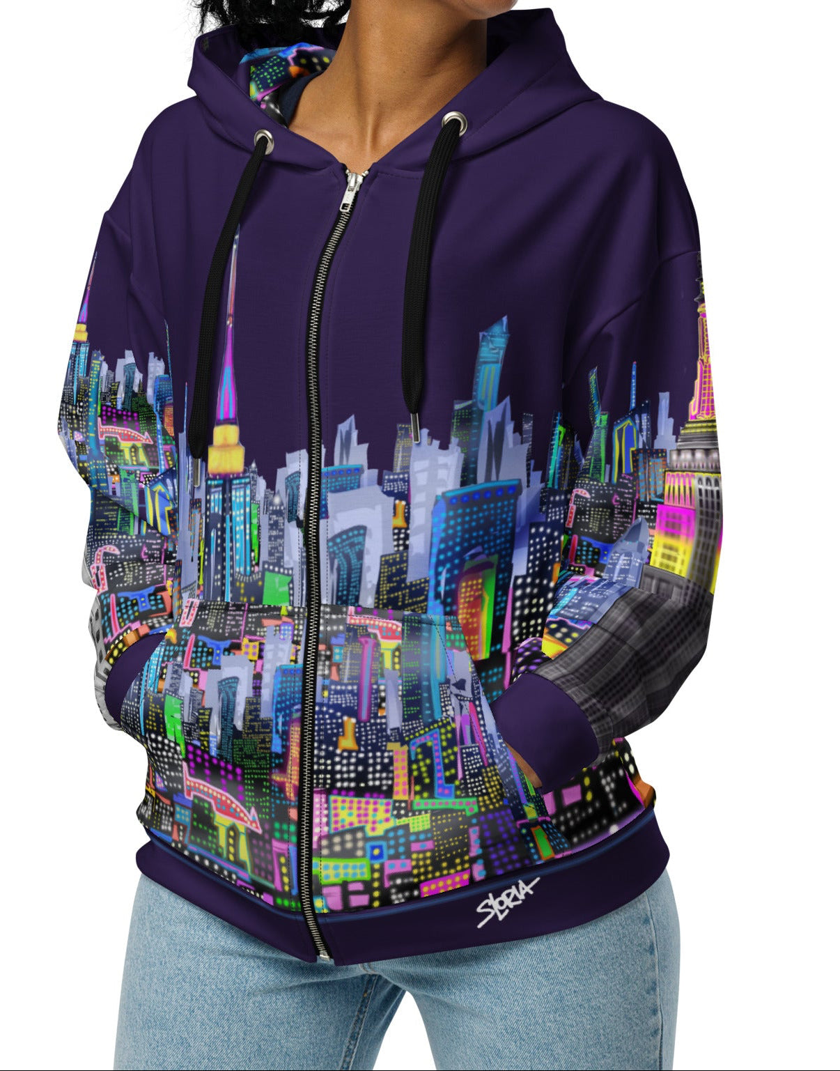 Front of Woman wearing a hoodie with a colorful cityscape Loria NYC Art design on a white background