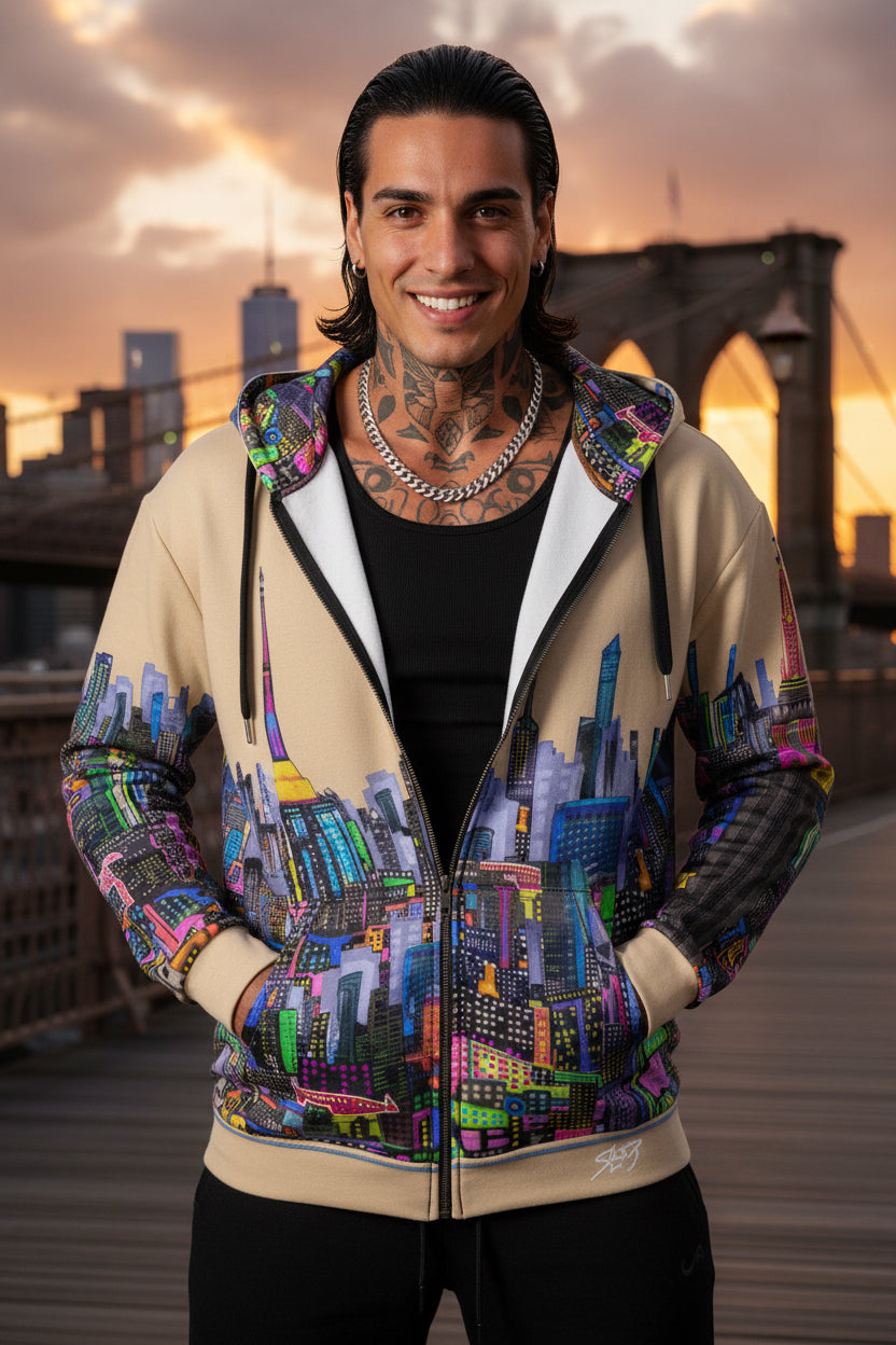 Man wearing a colorful Loria NYC Art jacket in a studio setting