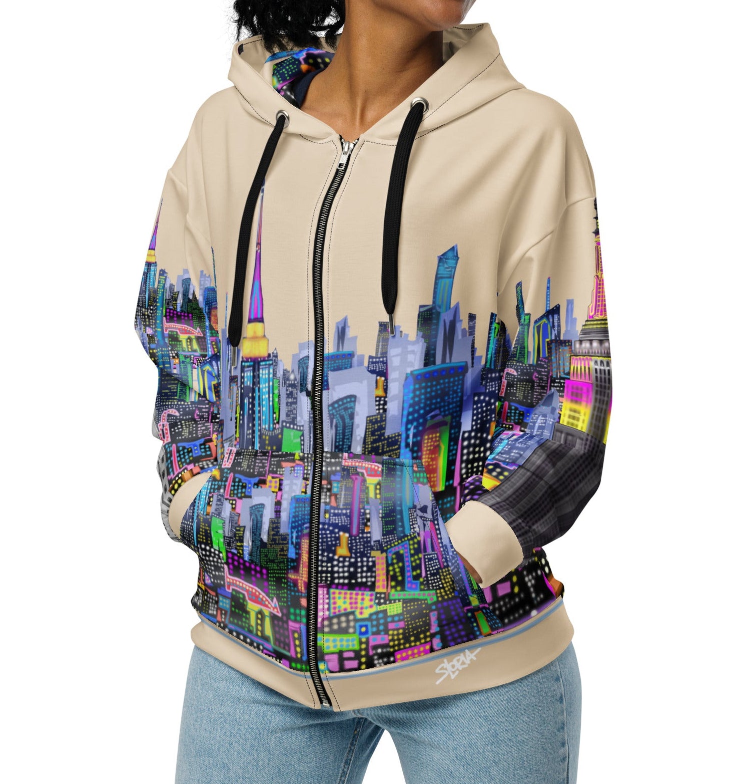 Woman wearing a hoodie with a colorful cityscape Loria NYC Art design on a white background