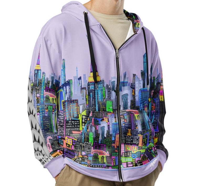Person wearing a colorful cityscape Loria NYC Art hoodie and beige cargo pants on a white background