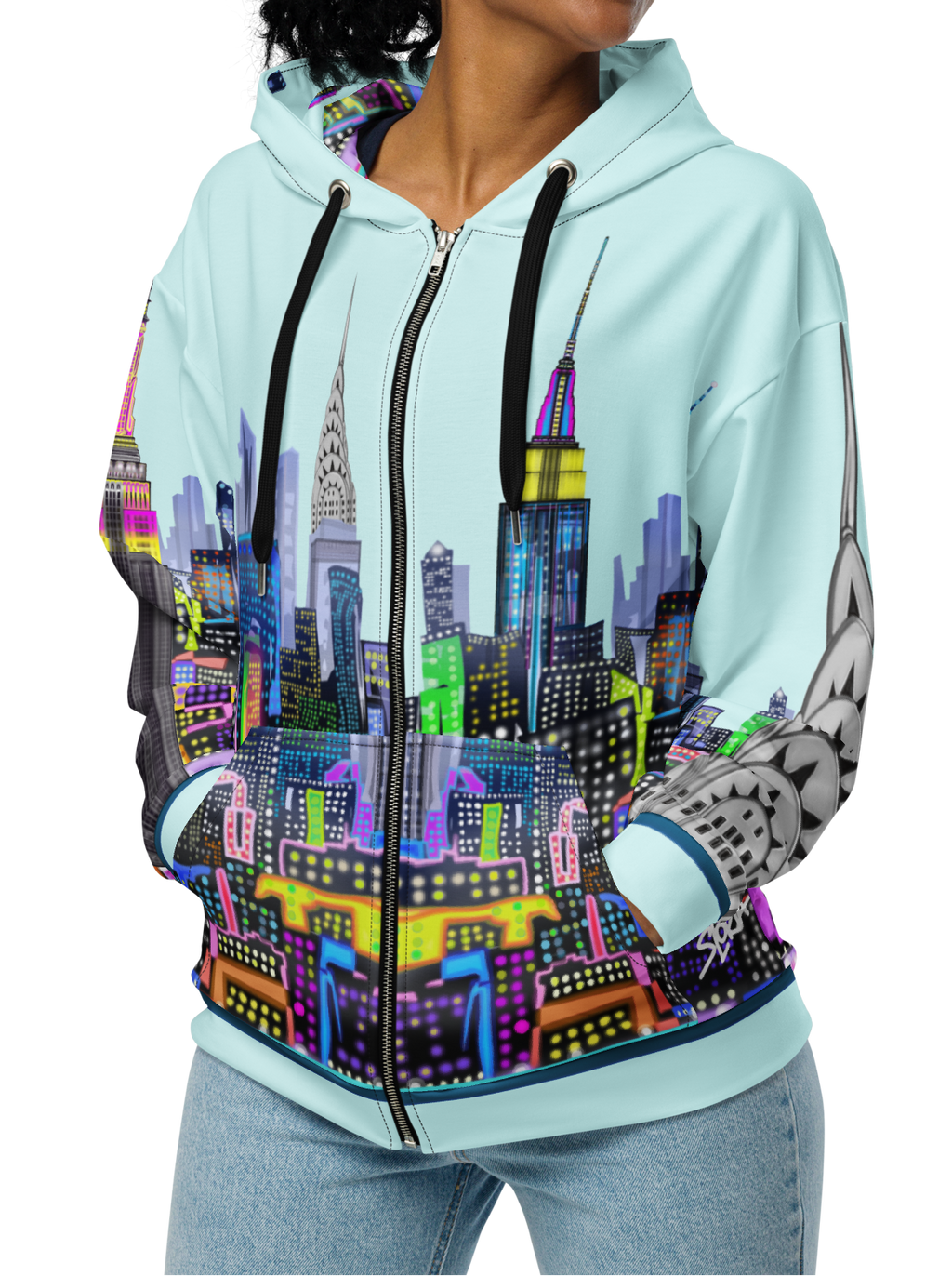 Woman wearing a hoodie with a colorful cityscape Loria NYC Art design on a white background