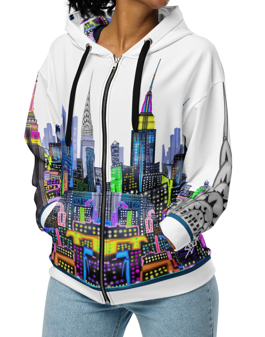 Person wearing a white hoodie with a colorful Loria NYC Art cityscape design on a white background