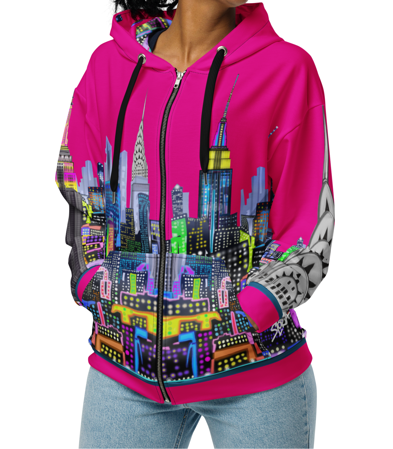 Woman wearing a Loria NYC Art hoodie with a colorful cityscape design on a white background