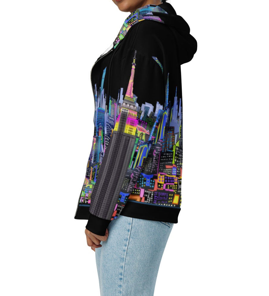 Side of girl modeling Black hoodie with colorful cityscape design by Loria NYC Art on a white background
