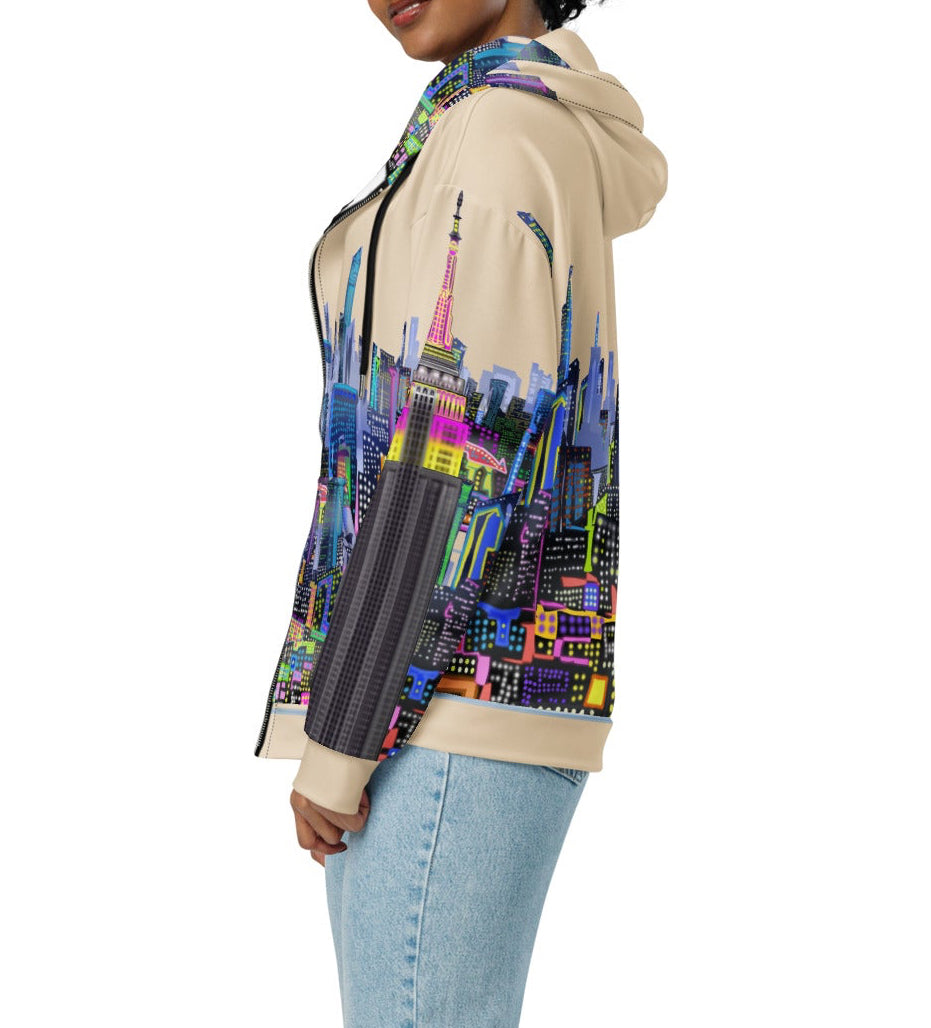 Person wearing a hoodie with a colorful cityscape Loria NYC Art design on a white background