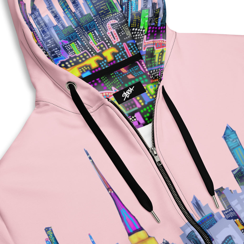 Pink hoodie with colorful cityscape Loria NYC Art design on the hood and back, brand logo visible.
