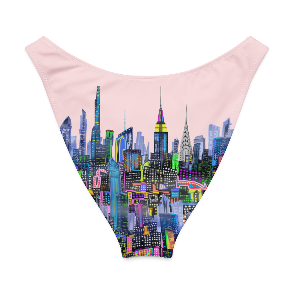 Back view of a swimsuit with a colorful cityscape Loria NYC Art design on a pink background