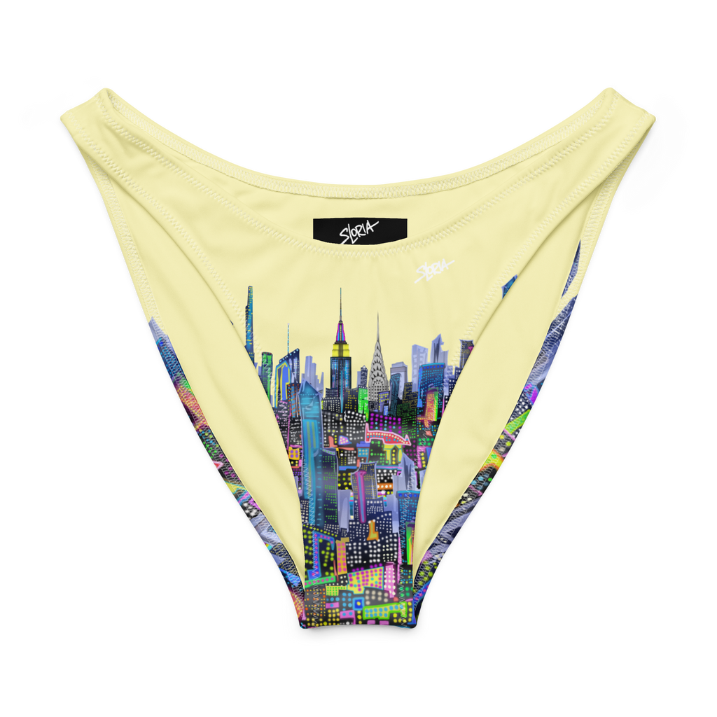 Beige bikini bottom with colorful Loria NYC Art cityscape design on a white background
