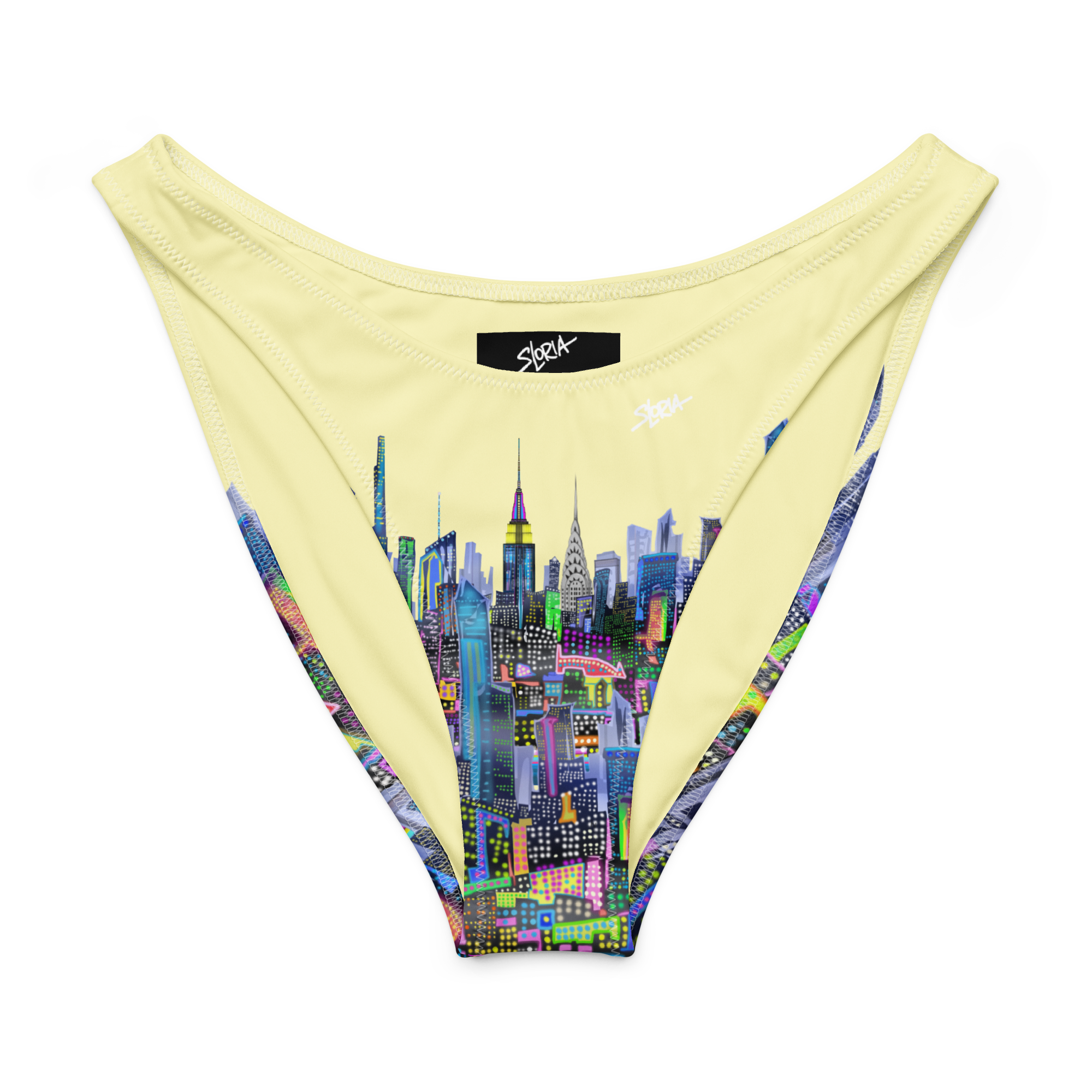 Beige bikini bottom with colorful Loria NYC Art cityscape design on a white background