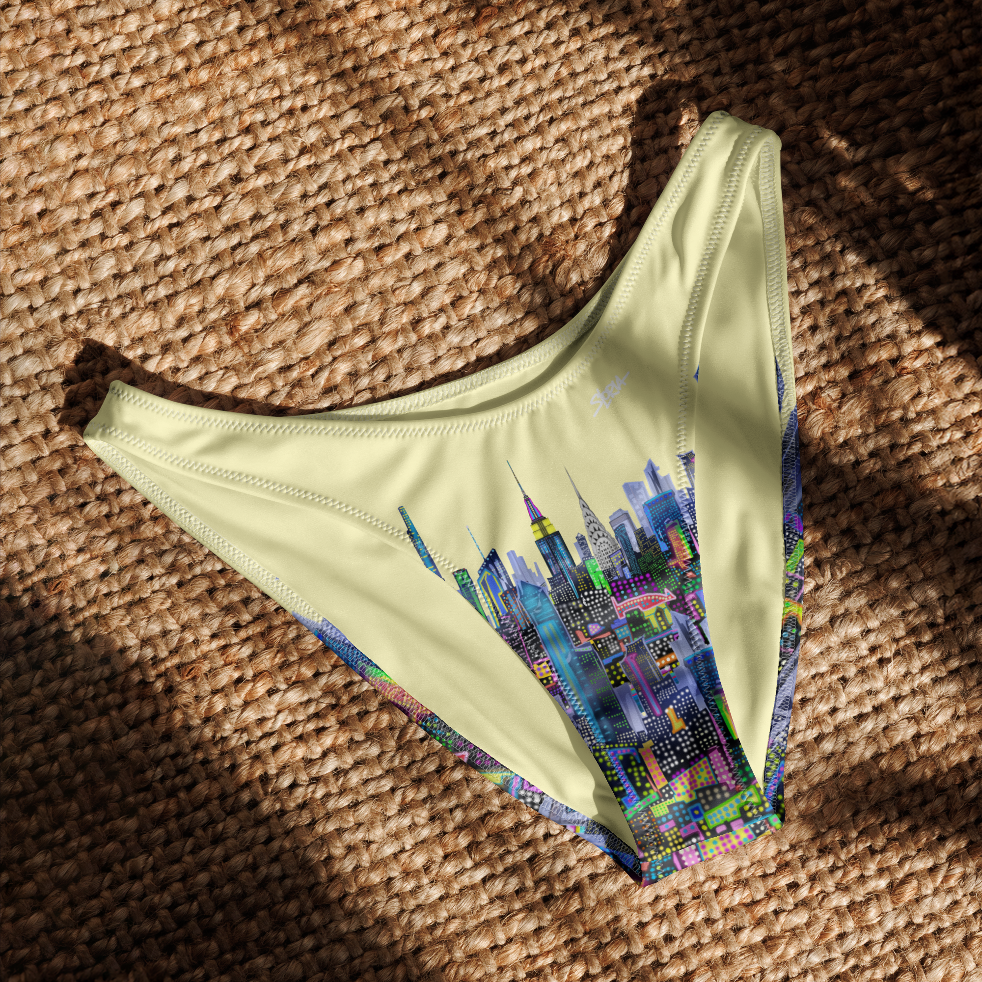 Bikini bottom with cityscape Loria NYC Art design on a textured surface