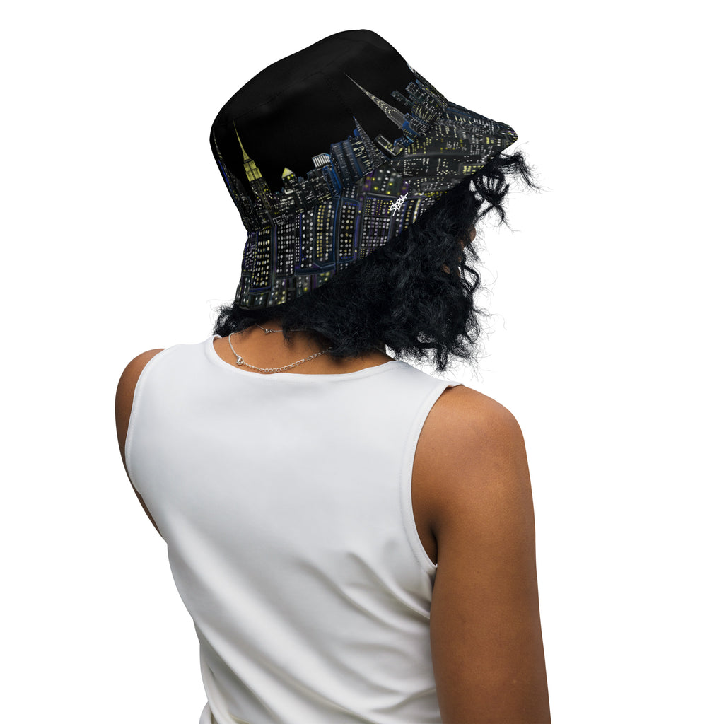 Women wearing Reversible Bucket Hat Città D’Oro e Notte Brown showing the Black  side designed by Loria NYC Art 