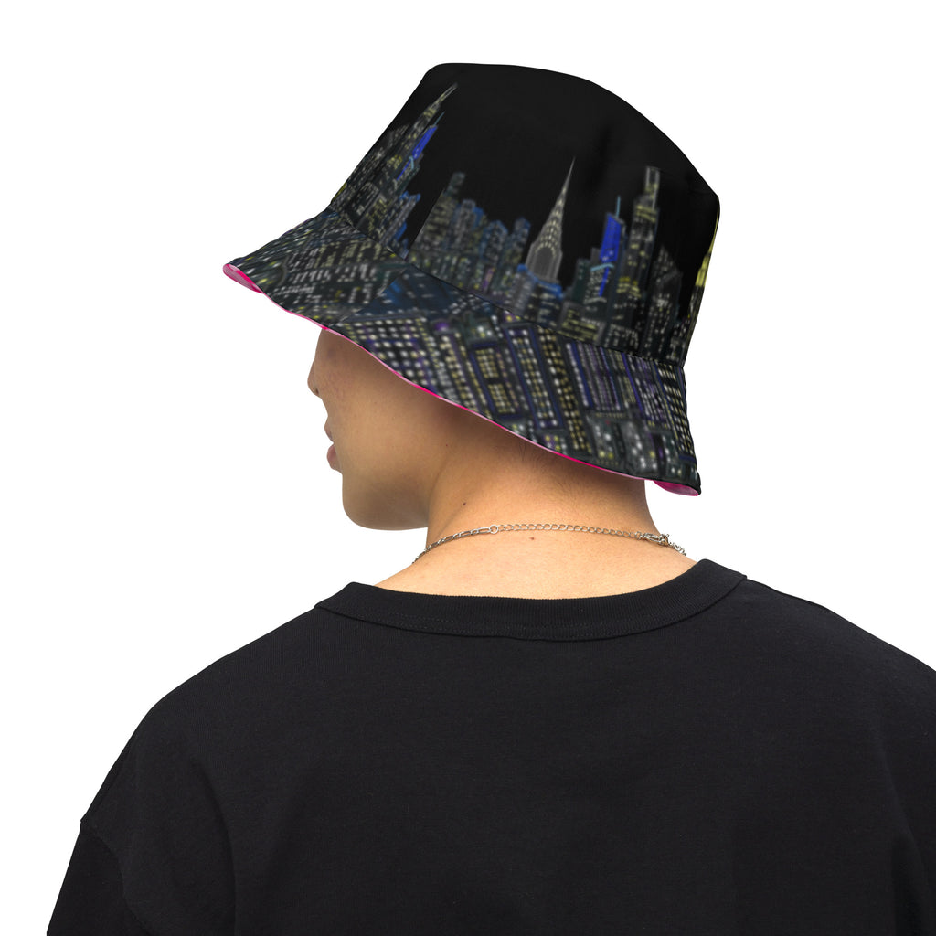 Man wearing  Reversible Bucket Hat with Città Rosa Vento Fuchsia NYC skyline designed with Brooklyn bridge by S.Loria NYC