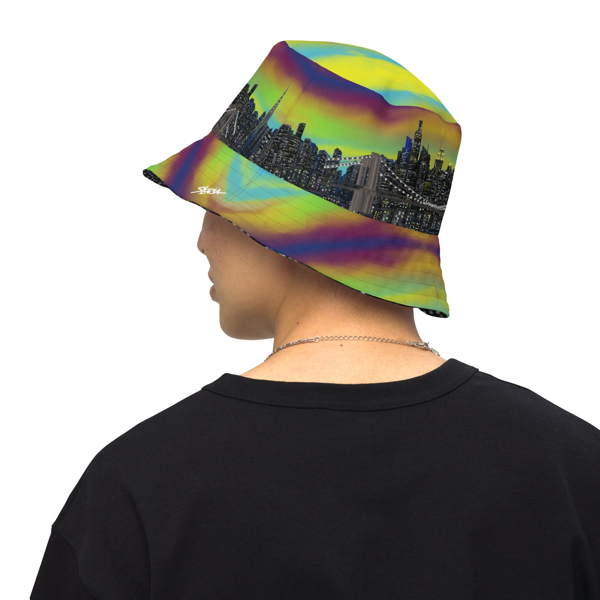 Man wearing a Reversible Bucket Hat with  Città Sole e Bosco Moody NYC skyline on both sides in different settings designed by S. Loria NYC Art