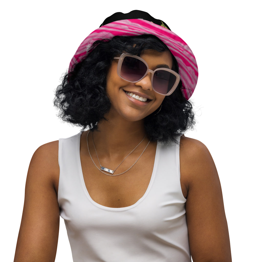 Women wearing  Reversible Bucket Hat with Città Rosa Vento Fuchsia NYC skyline designed with Brooklyn bridge by S.Loria NYC