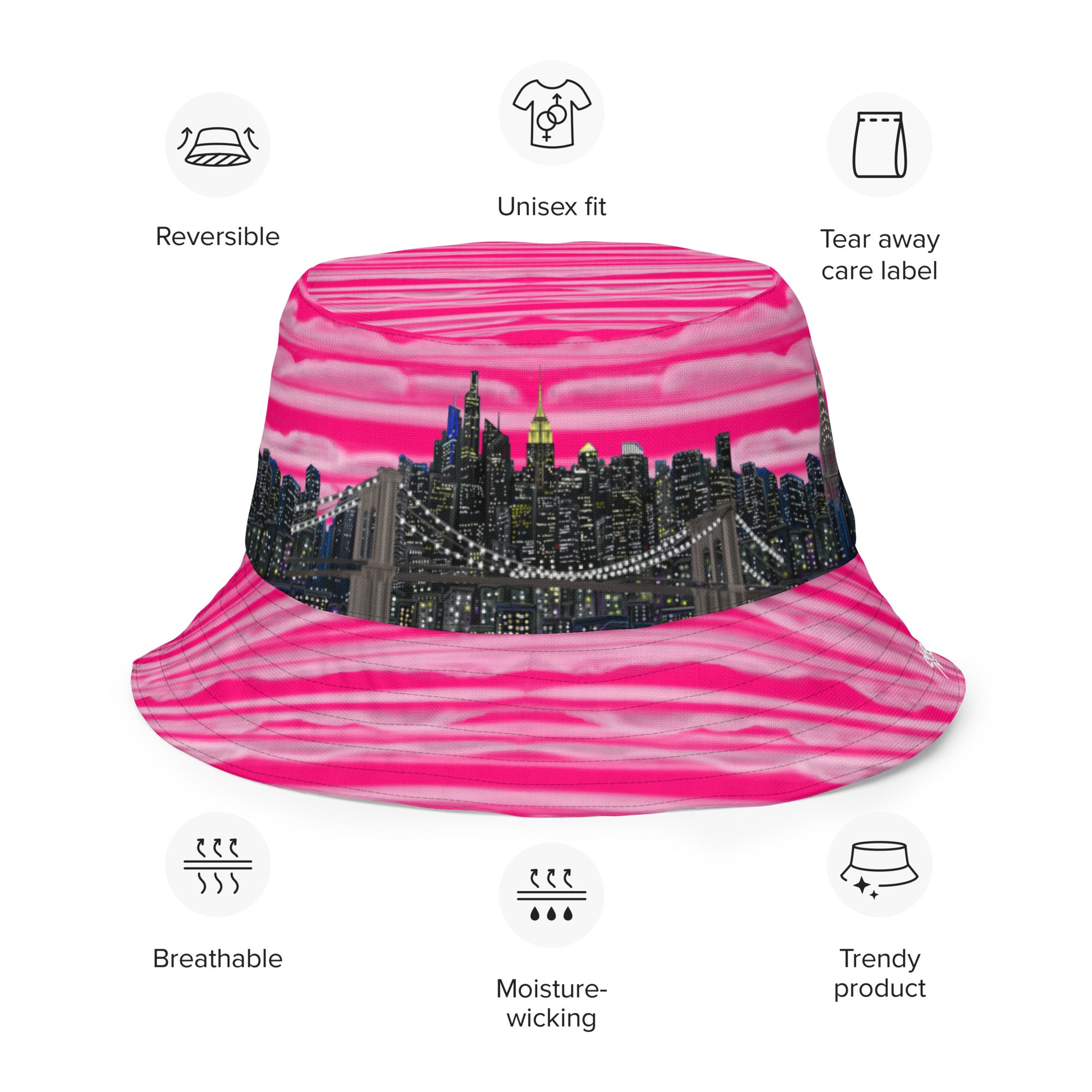 Pink and black bucket Loria NYC Art hat with cityscape design on a white background
