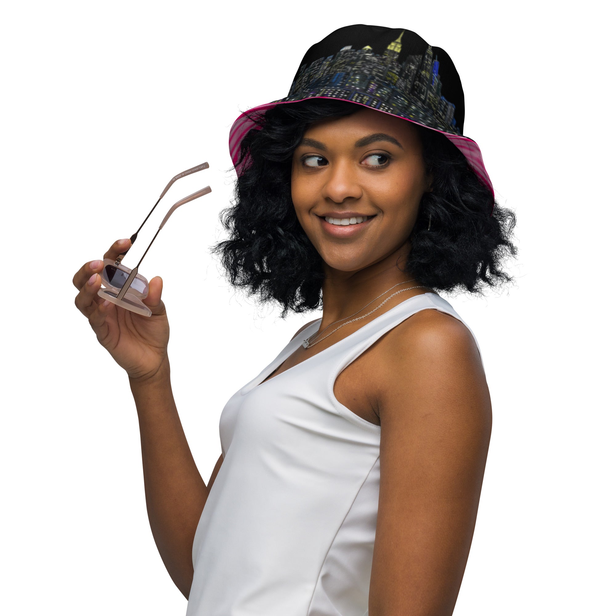 Women wearing  Reversible Bucket Hat with Città Rosa Vento Fuchsia NYC skyline designed by S.Loria NYC