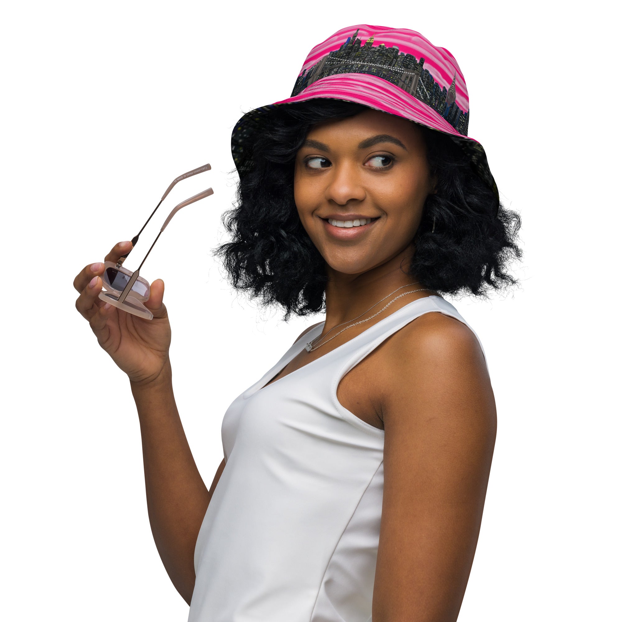Women wearing  Reversible Bucket Hat with Città Rosa Vento Fuchsia NYC skyline designed with Brooklyn bridge by S.Loria NYC