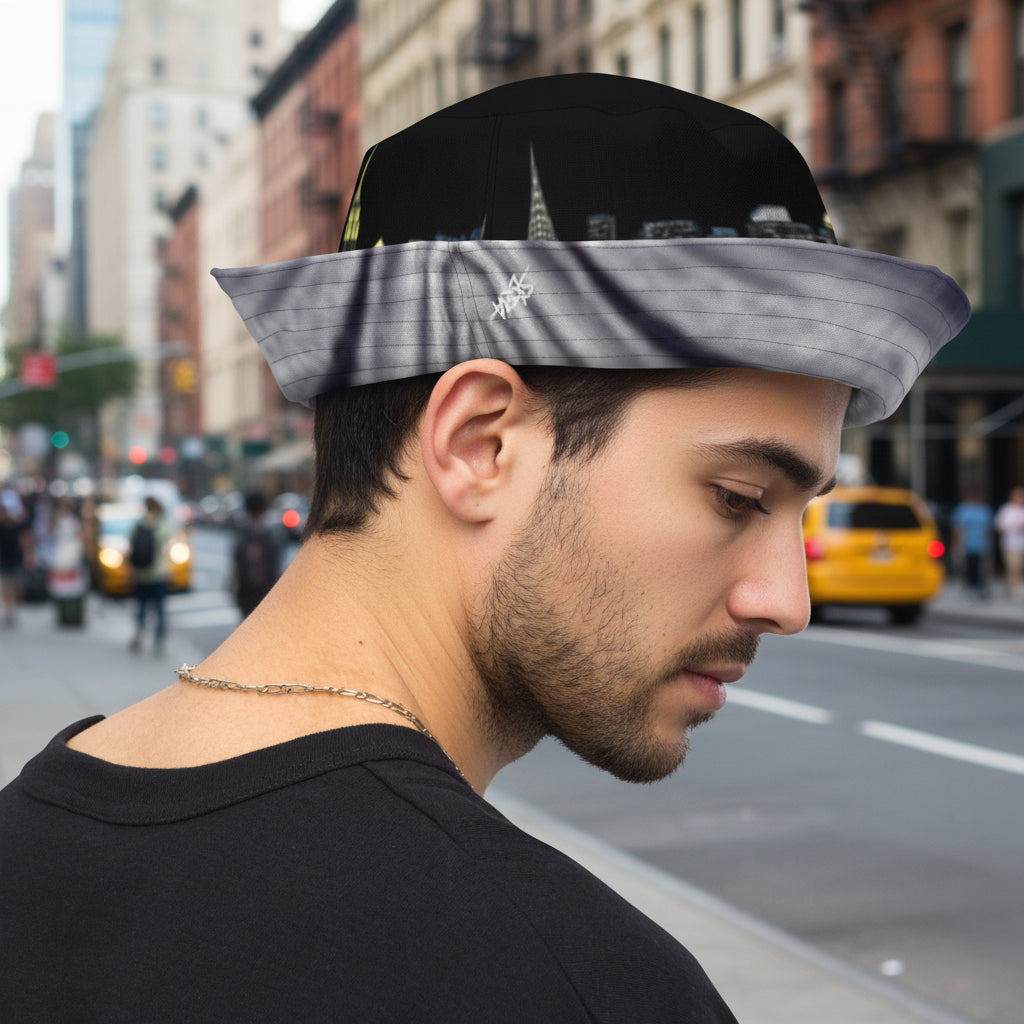 Man posing in Reversible Bucket Hat with Loria NYC Art Skyline design.