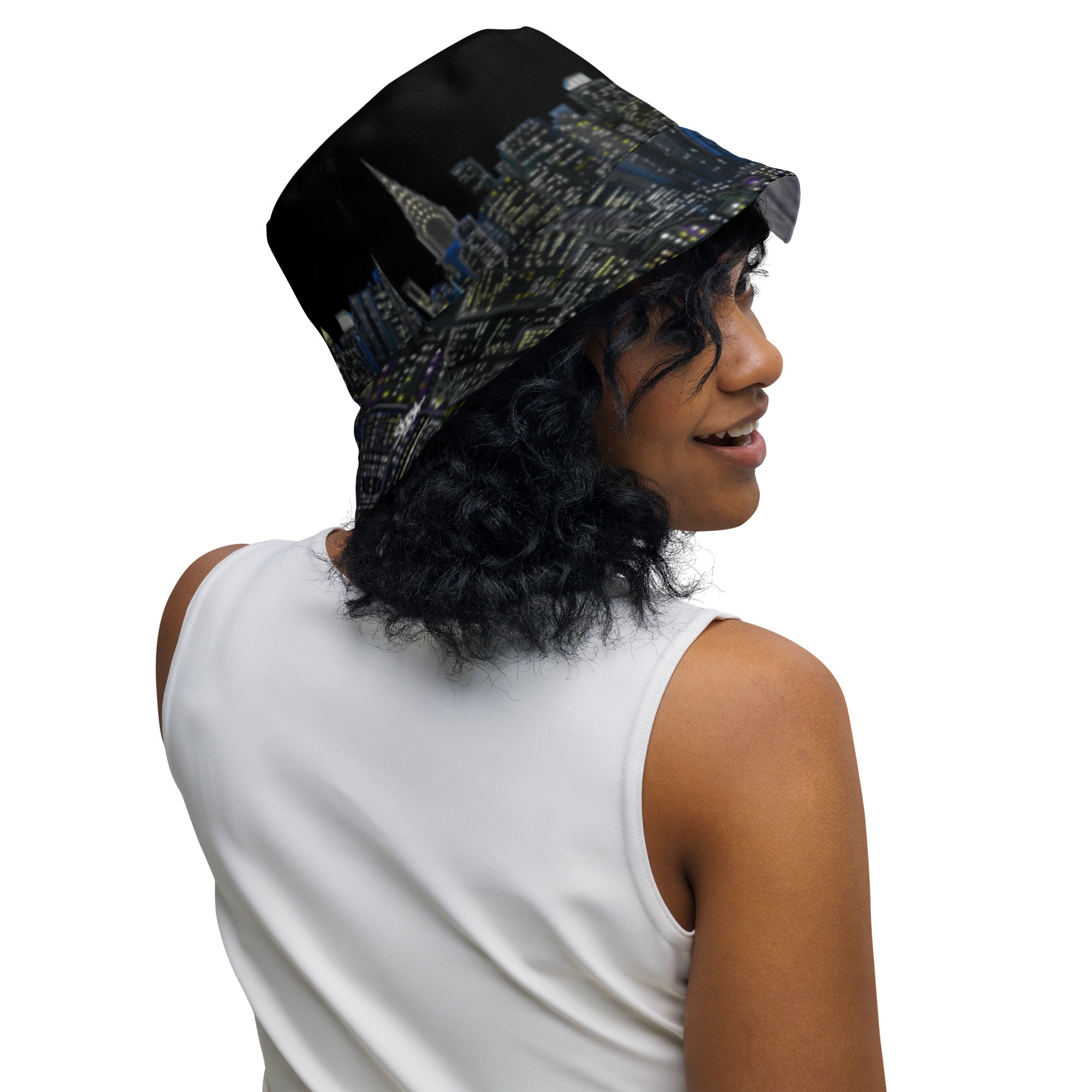 Women posing with Reversible Bucket Hat with Città Tempesta e Notte Skyline designed by S. Loria NYC Art