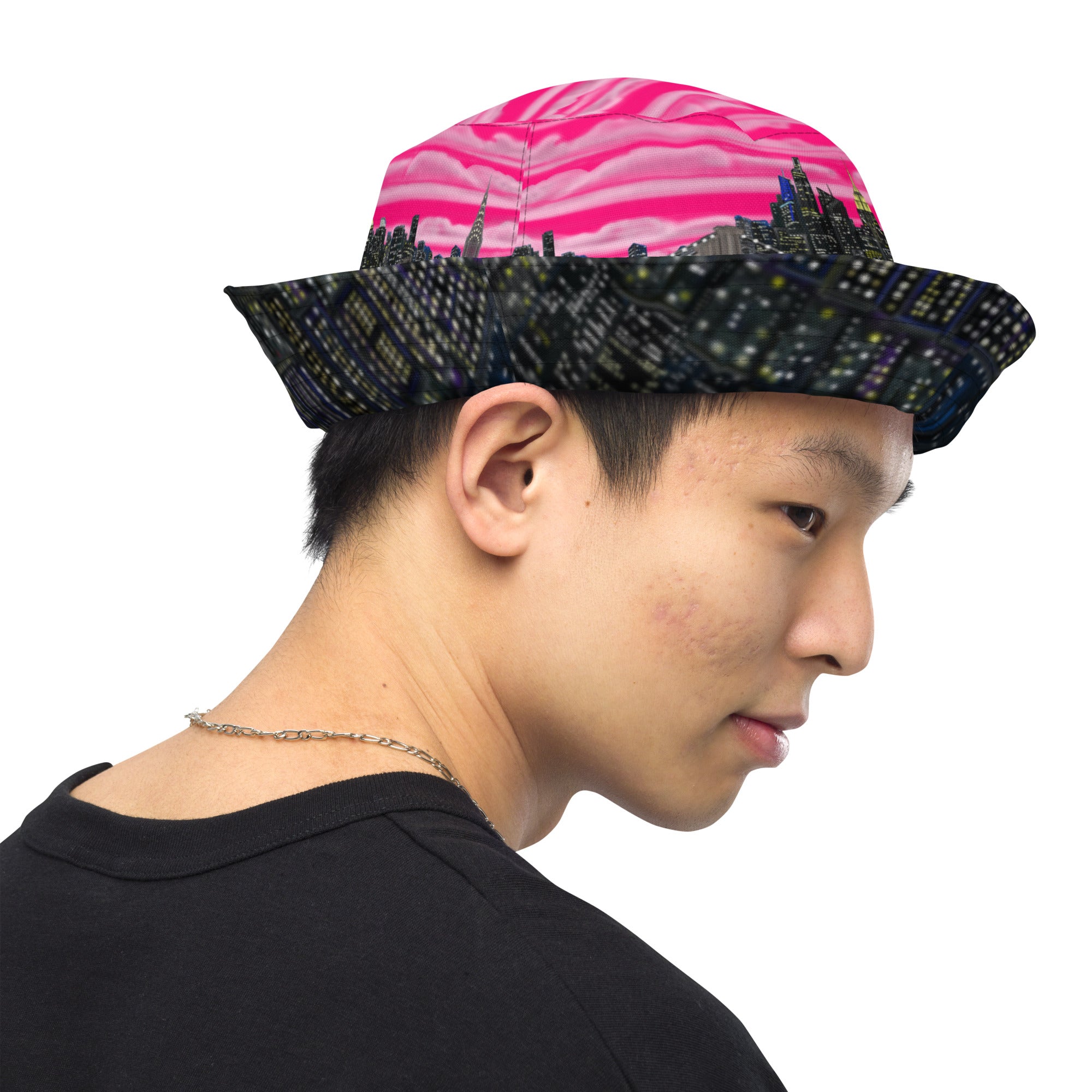 Man wearing  Reversible Bucket Hat with Città Rosa Vento Fuchsia NYC skyline designed with Brooklyn bridge by S.Loria NYC