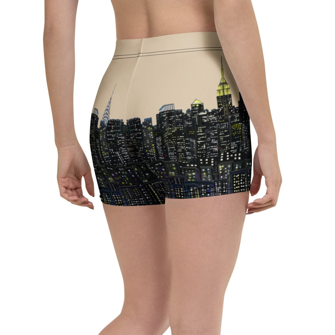 Person wearing black shorts with cityscape Loria NYC Art design on a white background