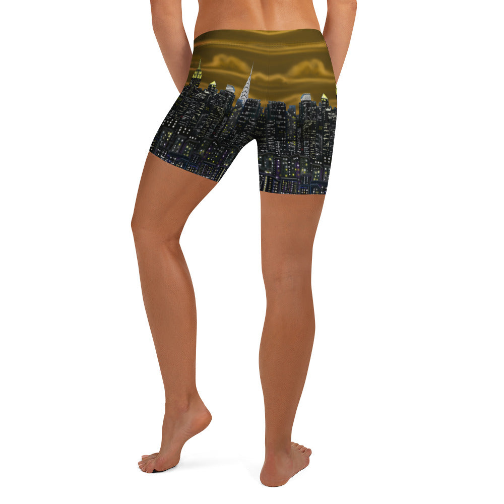 Person wearing shorts with a cityscape Loria NYC Art design on a white background