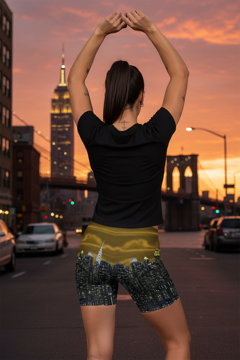 Person wearing shorts with a Loria NYC Art cityscape design on a urban background