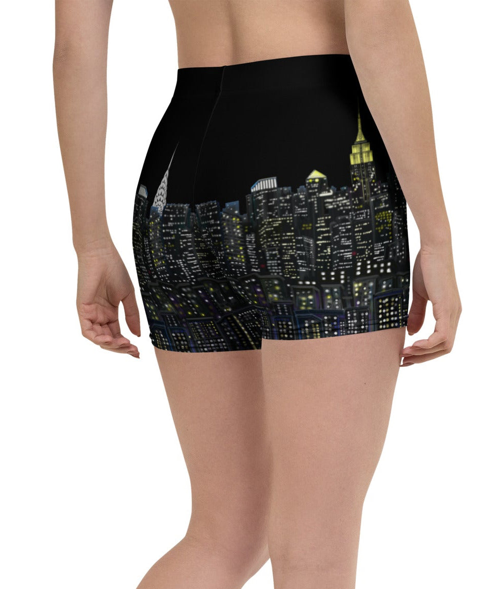 Person wearing black Loria NYC Art athletic shorts with a pattern on a white background