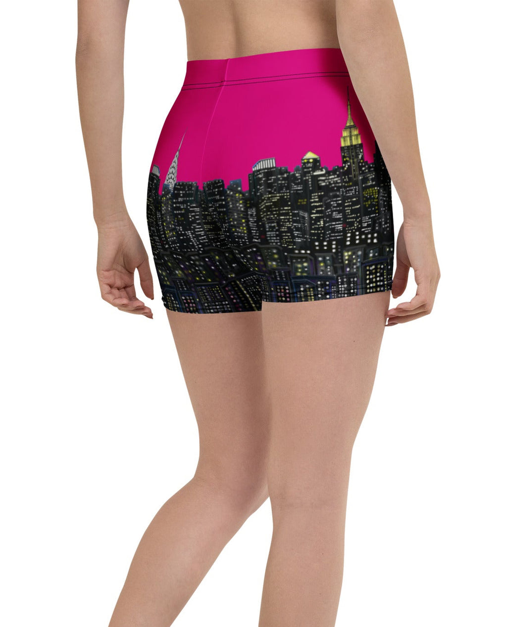 Person wearing shorts with a Loria NYC Art cityscape design on a white background