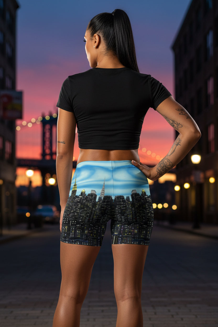 Person wearing shorts with a Loria NYC Art cityscape design on a urban background