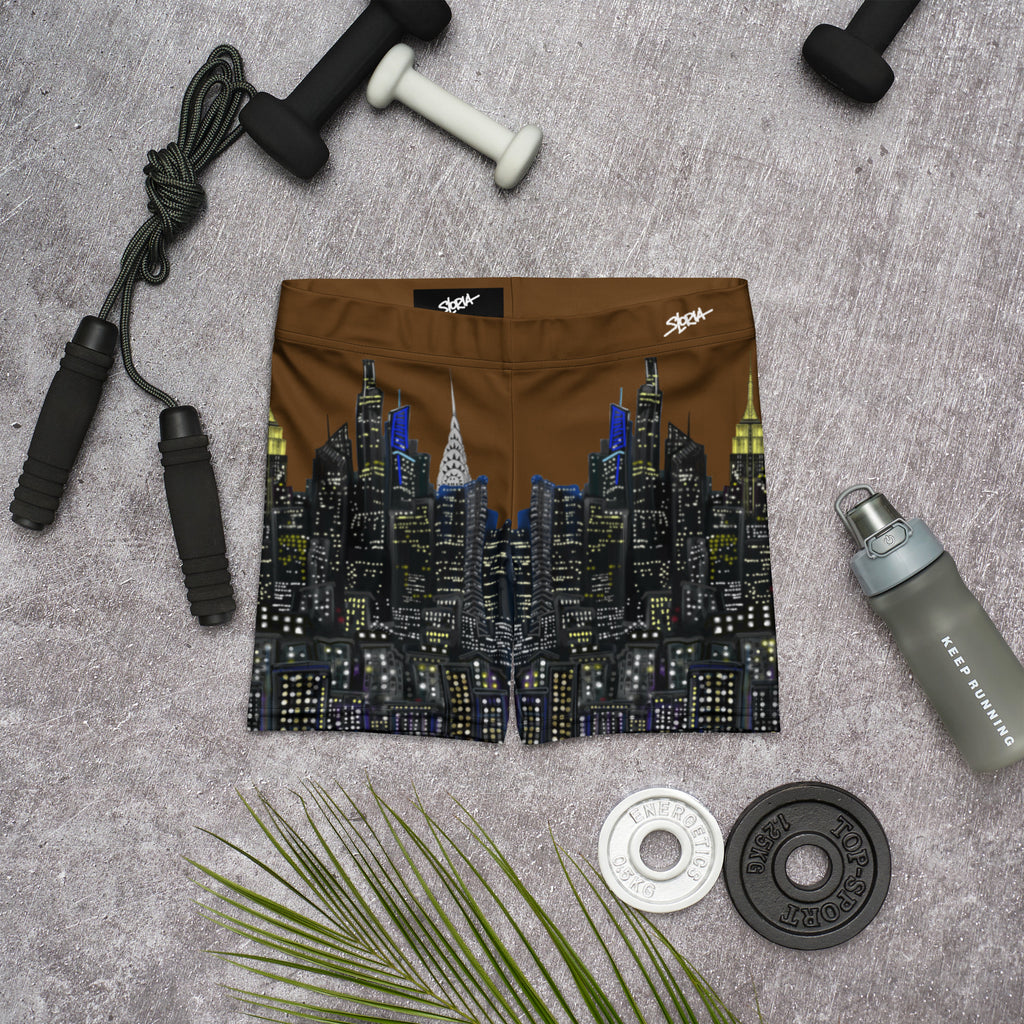 Cityscape Loria NYC Art shorts on a gray surface with fitness equipment
