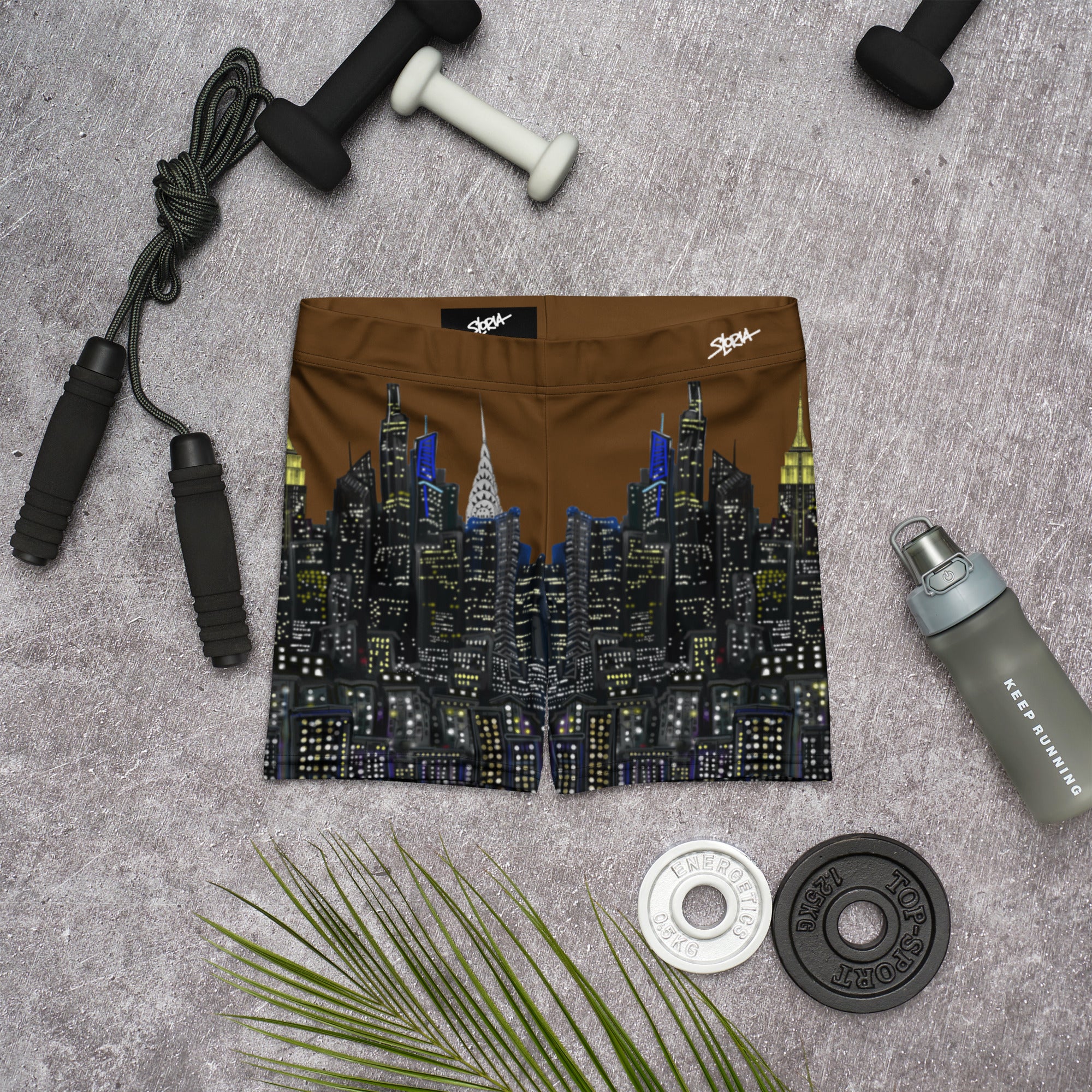 Cityscape Loria NYC Art shorts on a gray surface with fitness equipment