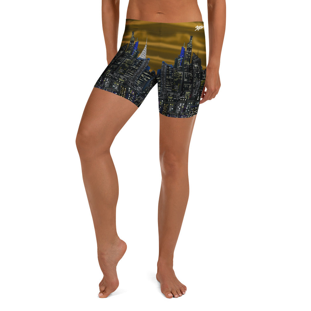 Person wearing shorts with a cityscape Loria NYC Art design on a white background