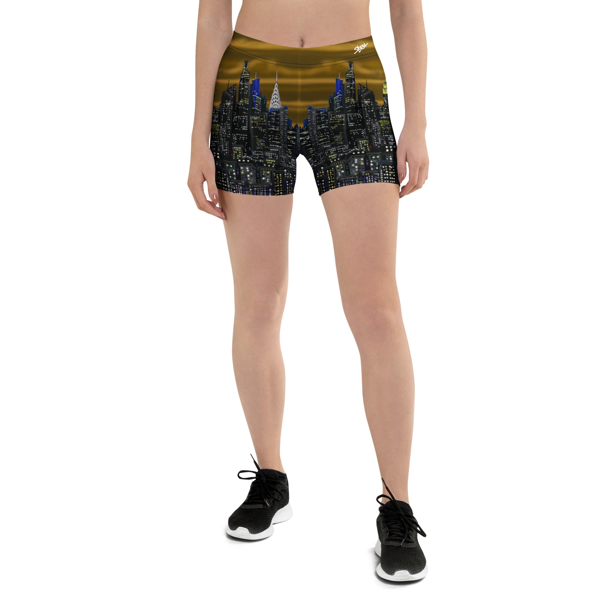 Person wearing shorts with a Loria NYC Art cityscape design on a white background