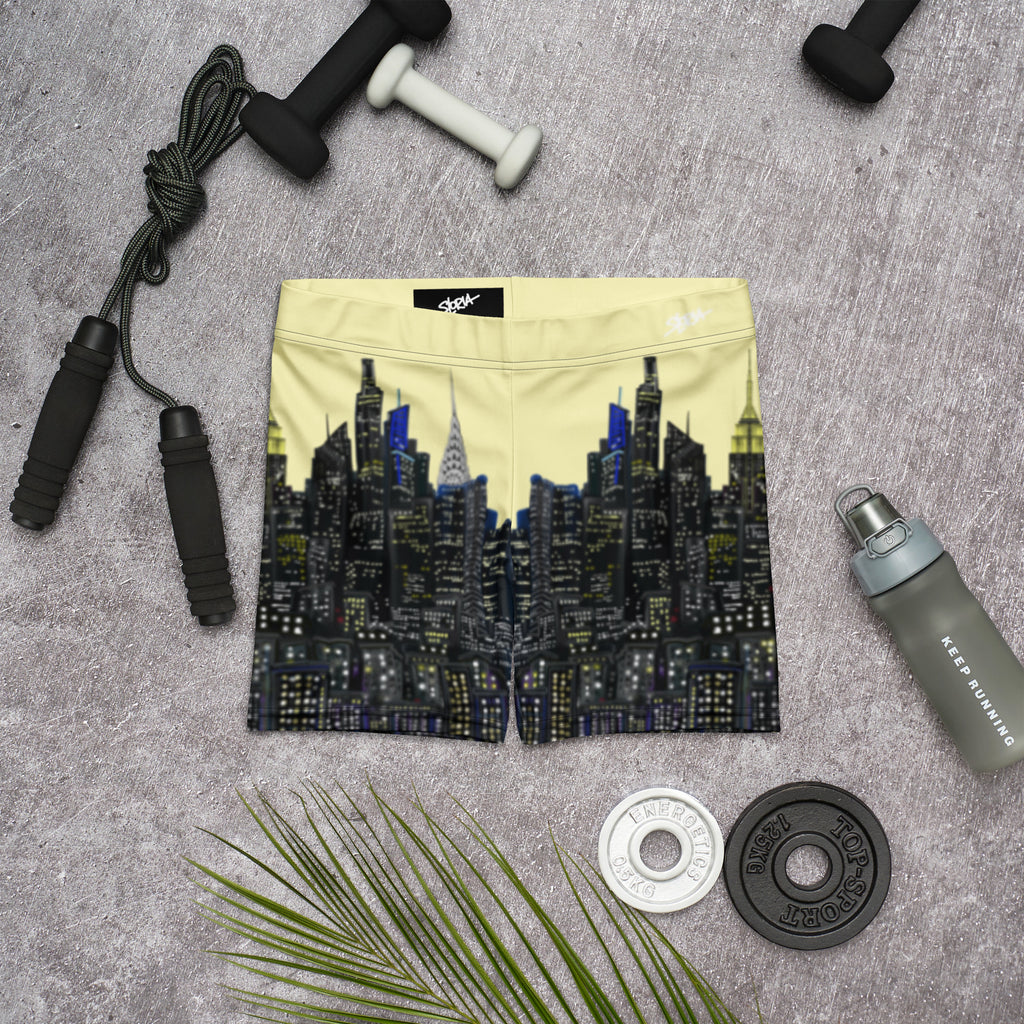NY Cityscape design shorts with fitness equipment on a gray surface
