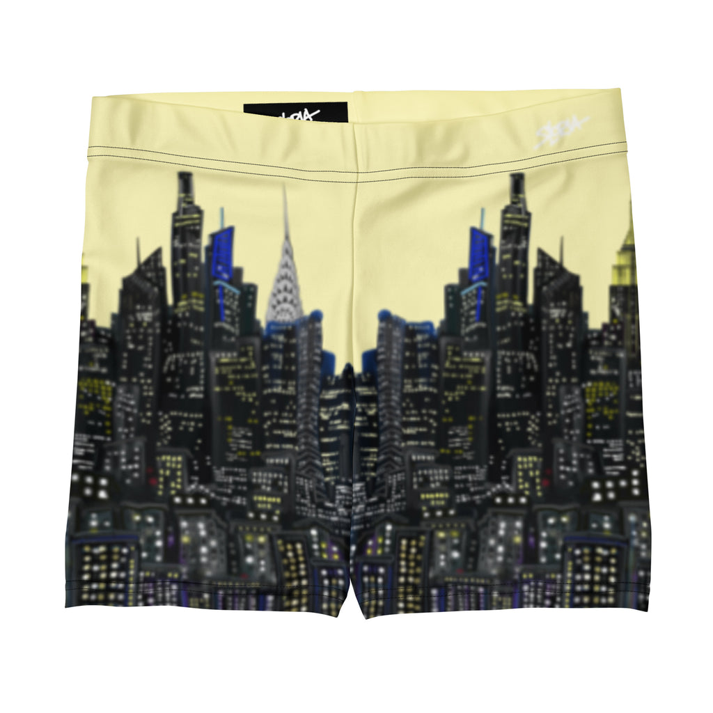 Yellow shorts with a Loria NYC Art cityscape design on a white background