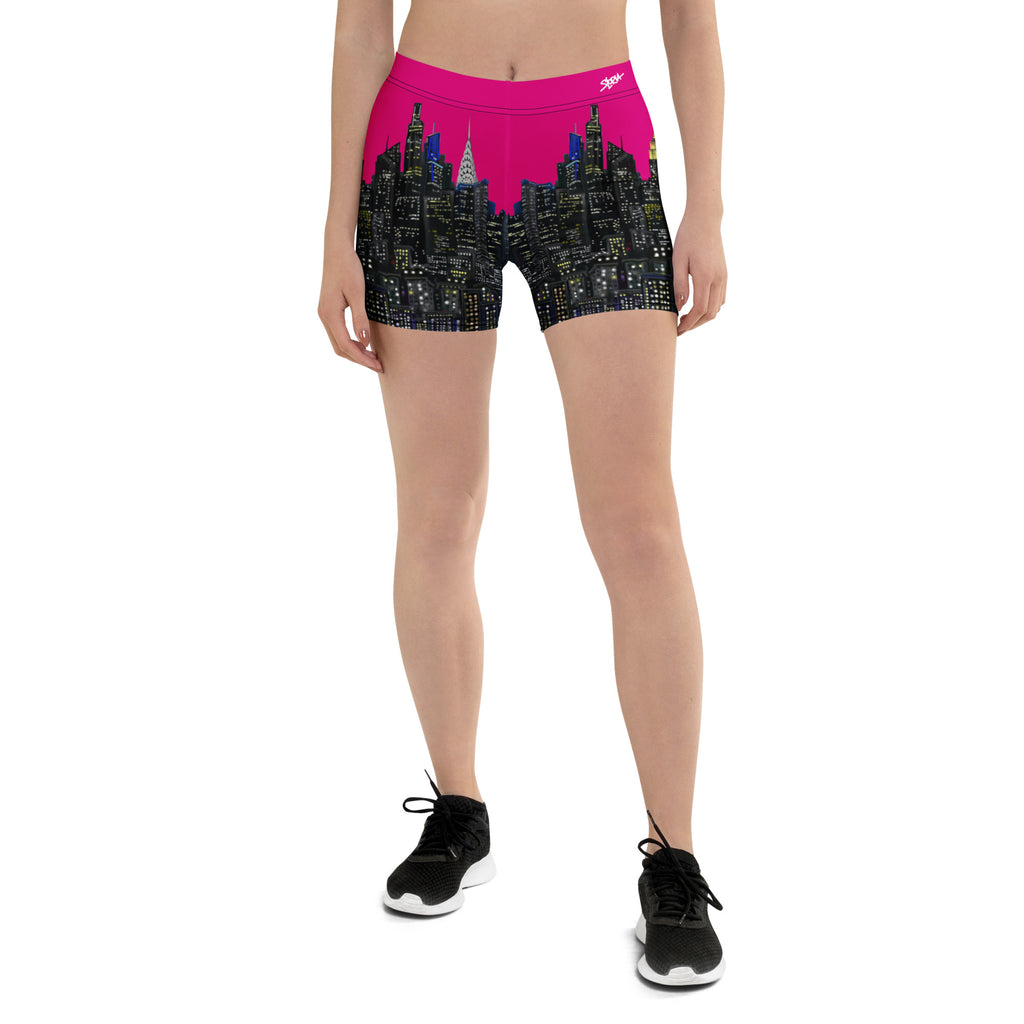 Person wearing pink and black shorts with cityscape Loria NYC Art design on a white background