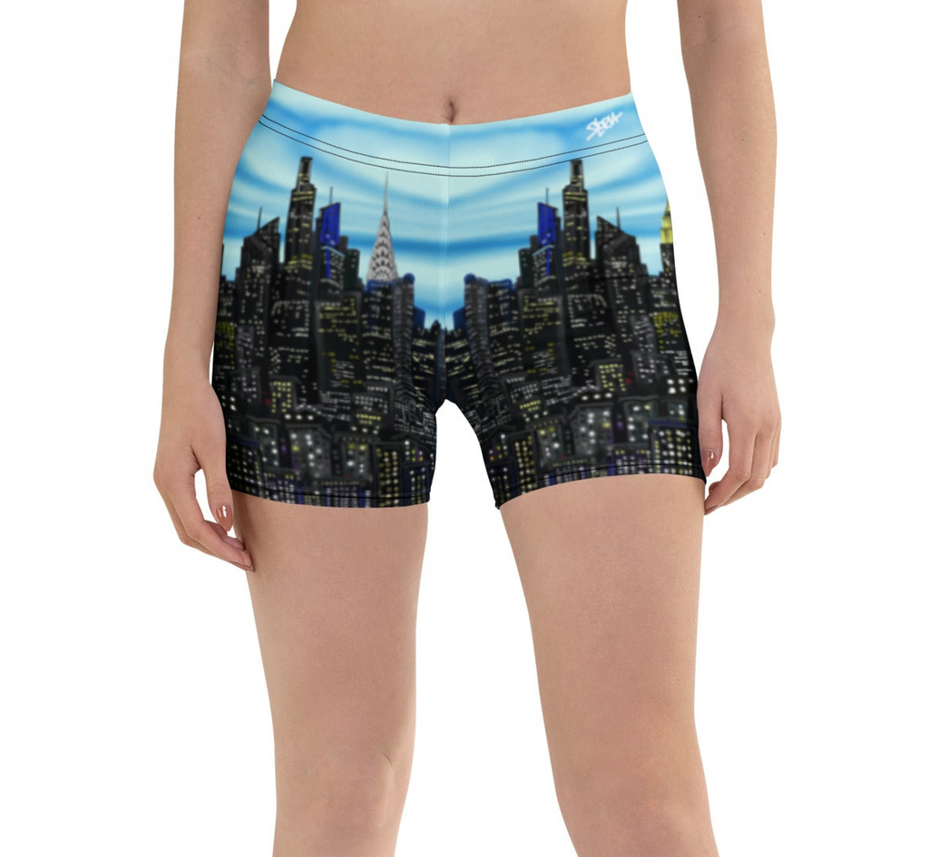 Person wearing shorts with a cityscape Loria NYC Art design on a white background