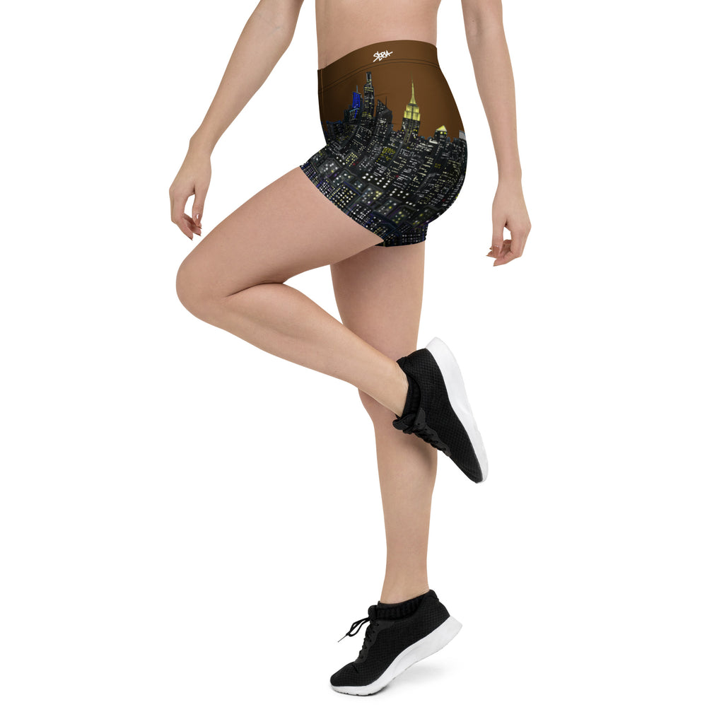 Person wearing shorts with a cityscape Loria NYC Art design on a white background