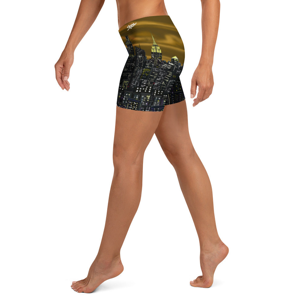 Person wearing shorts with a cityscape Loria NYC Art design on a white background