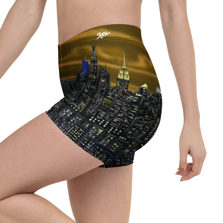 Person wearing shorts with a Loria NYC Art cityscape design on a white background