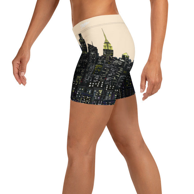 Person wearing beige shorts with a NYC S. Loria design on a white background